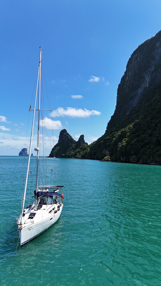 Boat in the ocean near mountain