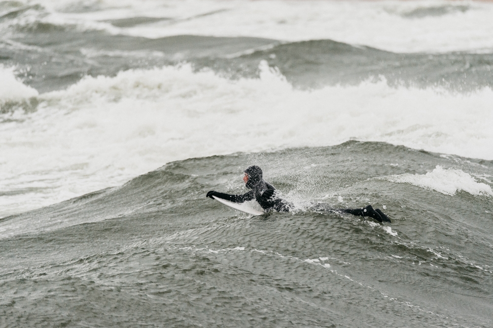 Domas Rimeika paddling in surf