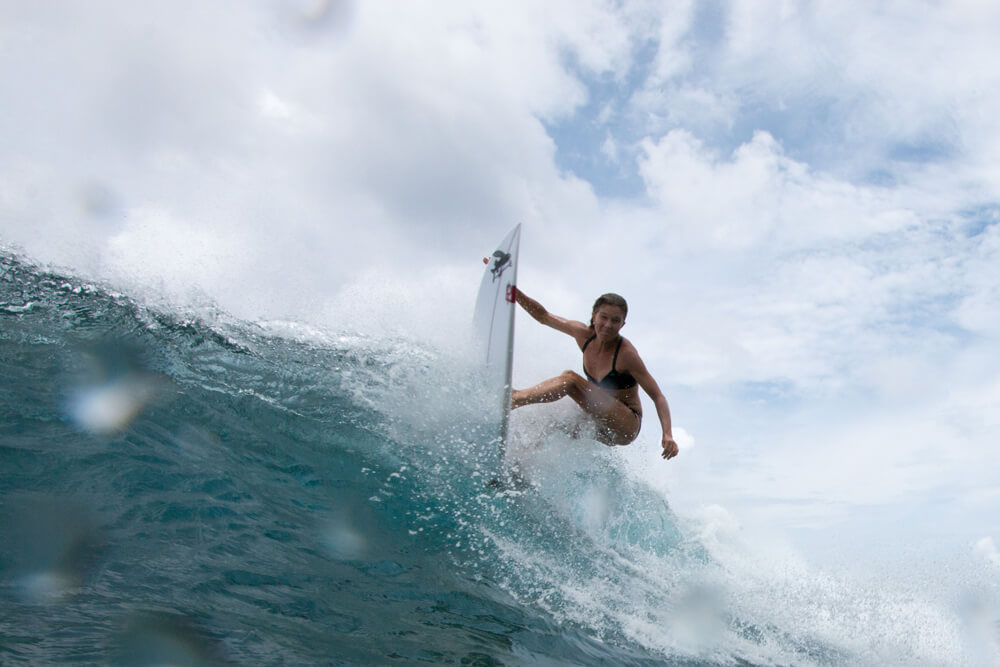 Liz Clark surfing