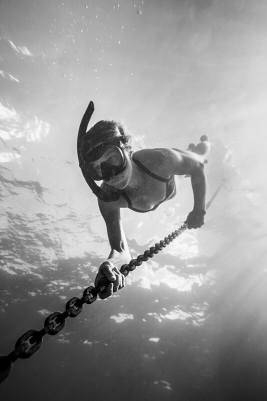 Liz Clark swimming down anchor chain