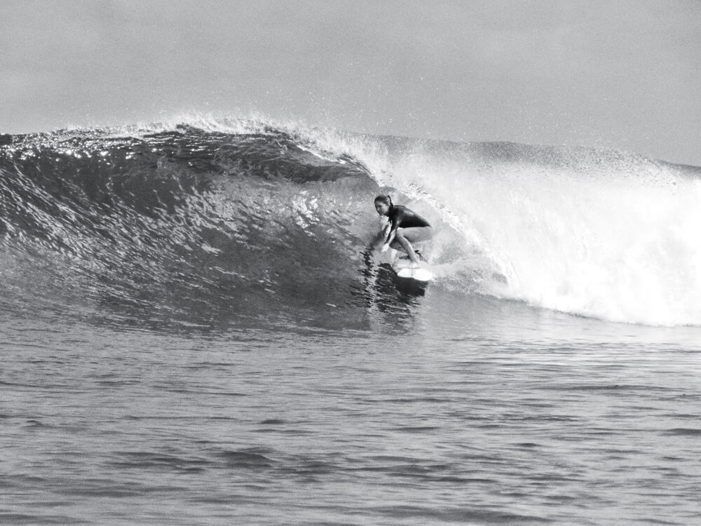 Liz Clark surfing