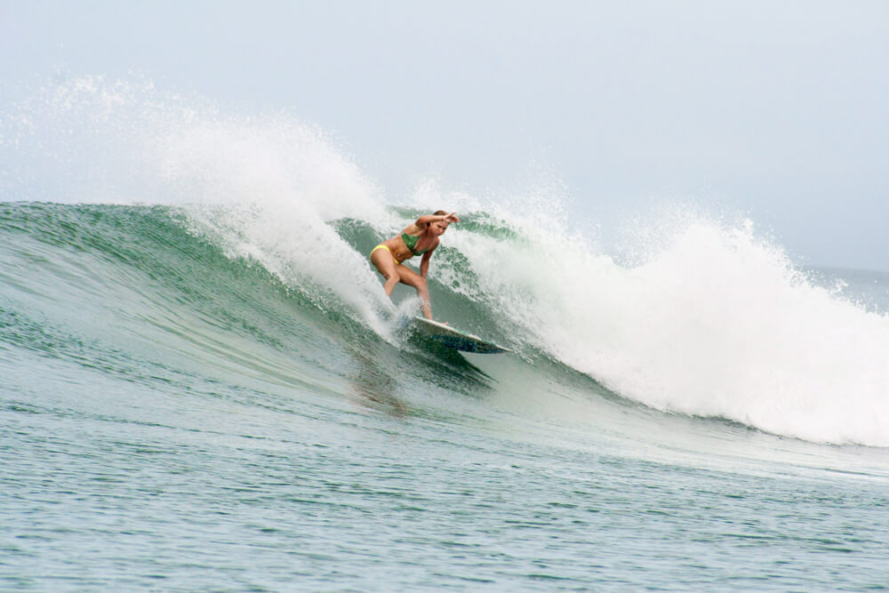 Liz Clark surfing
