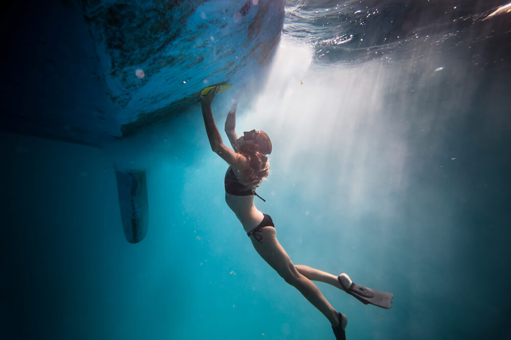 Liz Clark cleaning bottom of boat