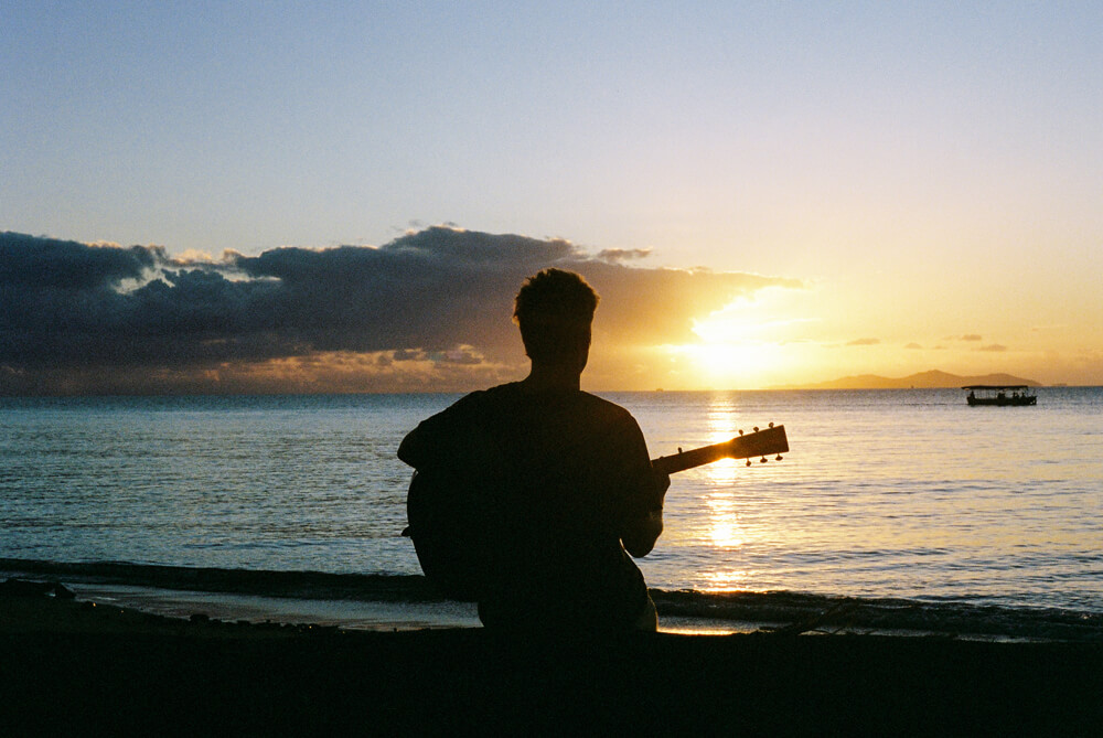Ziggy Alberts playing guitar